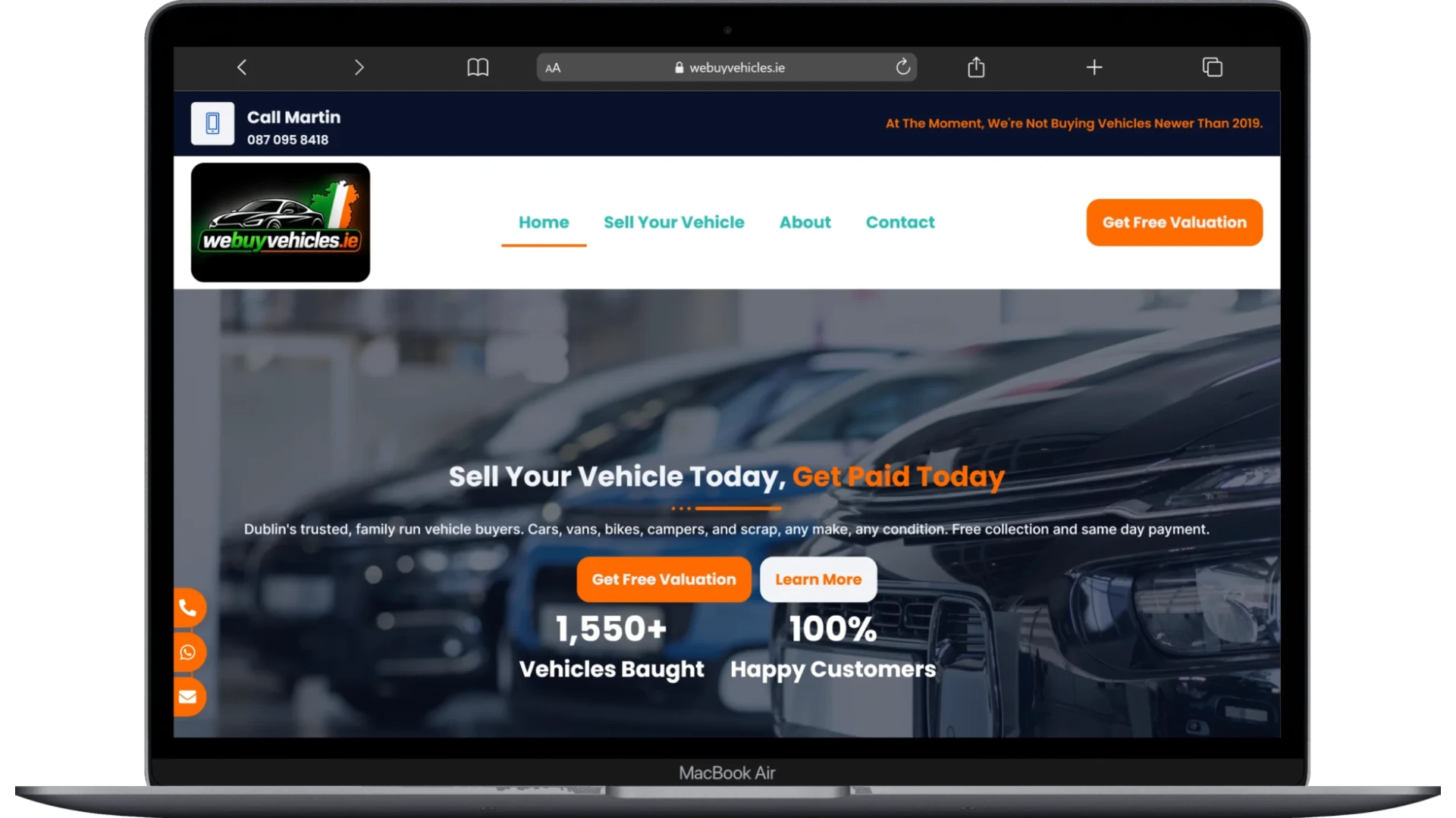 We Buy Vehicles website homepage shown on a laptop